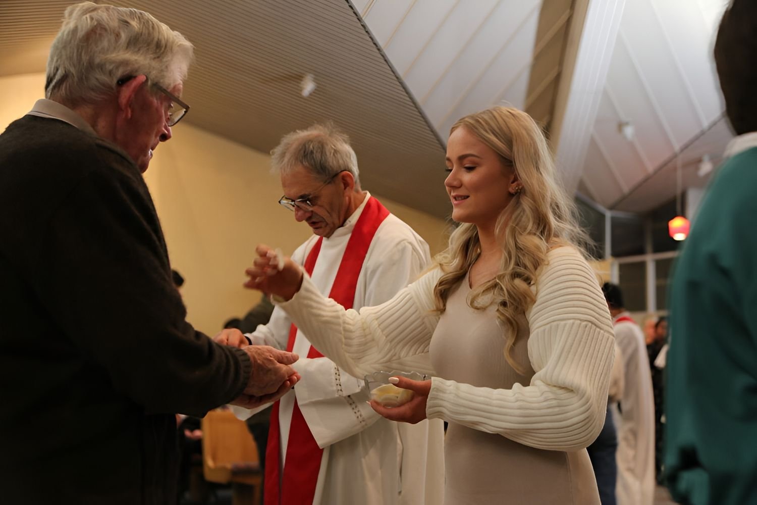 A parishioner receiving Holy Communion during Mass